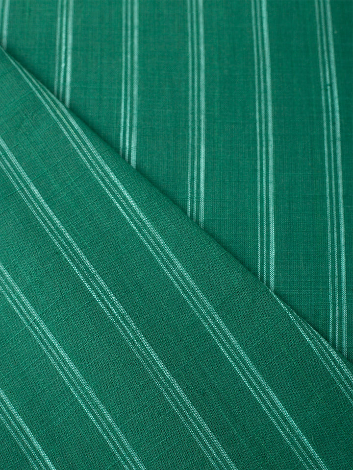 Green night shirt, fabric close up